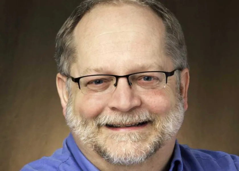 John smiling at the camera