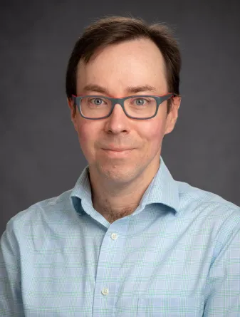 Ben Balas looking confidently at camera. 