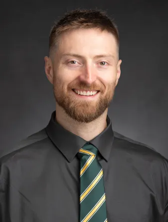 Ian smiling at the camera