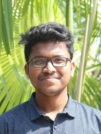 Fazle smiling at the camera.