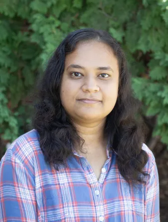 mahmuda smiling at the camera.