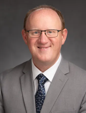 Tyler Wottrich smiling confidently at camera. 