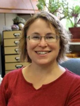 Donna Jacob smiling confidently at camera. 