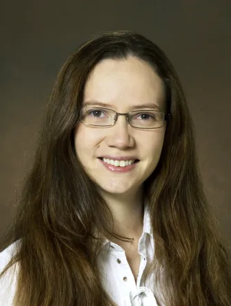 Pam is smiling for the camera