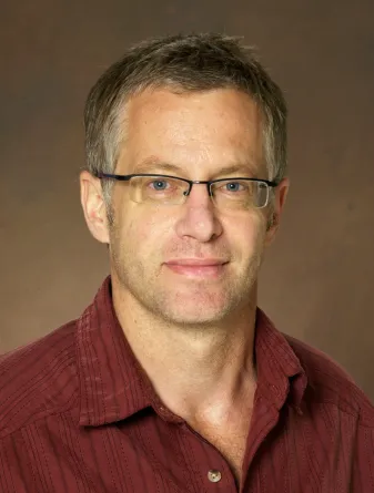 Erik Hobbie smiling confidently at camera.