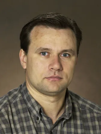 Andrei Kryjevski looking confidently at camera.