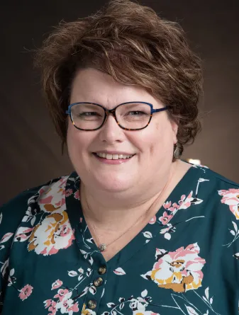 Sara Sunderlin smiling confidently at the camera