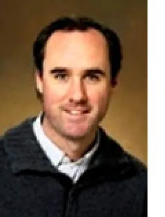 Timothy Greives smiling confidently.