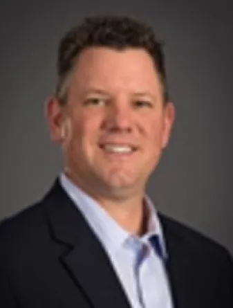 Professional headshot photo of Brian King.