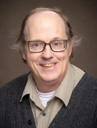 John Hershberger smiling confidently at the camera