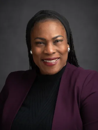 Bukola smiling at the camera