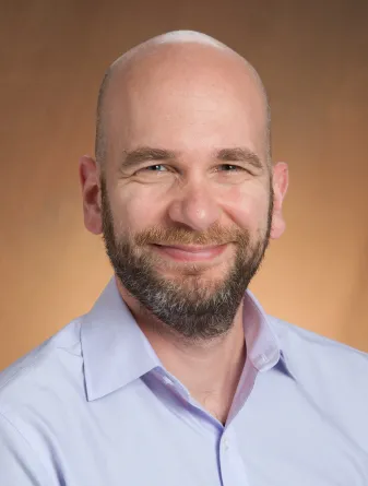 Zoltan smiling at camera