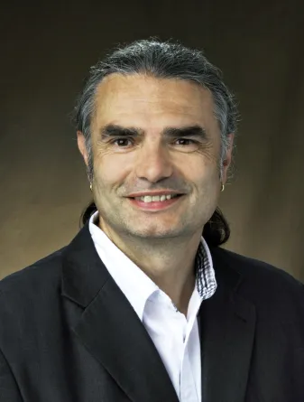 Dante Battocchi smiling confidently at the camera.