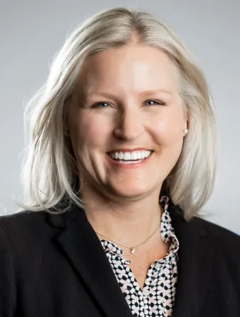 Victoria J. Gelling smiling confidently at the camera.