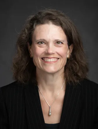 Stichman smiling confidently at camera