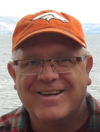 Craig smiling confidently at camera.