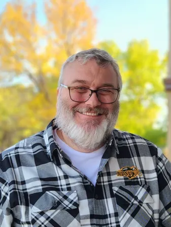 Mitch smiling at the camera.