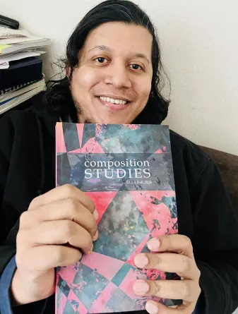 Nasih smiing at the cameral.