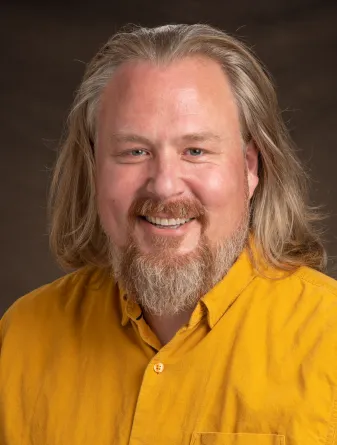 Christensen smiling confidently at camera.