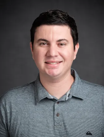 Tyler Garcia smiling confidently at camera.