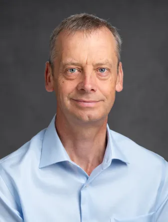 Dr. Martin Coleman confidently staring at the camera