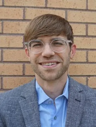 Dr. Jeremy Hamm confidently staring at the camera