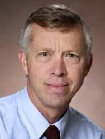 Dr. Kevin McCaul confidently staring at the camera