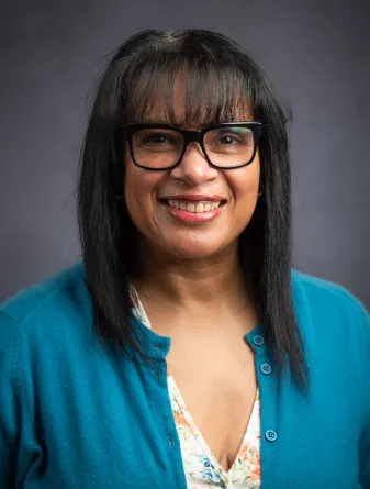 Nadeje smiling confidently at camera