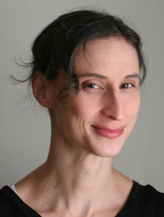 Jess smiling confidently at camera