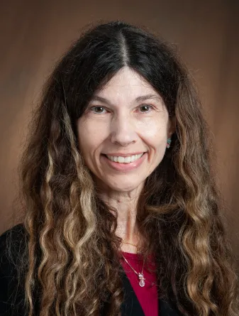 Magel smiling confidently at camera