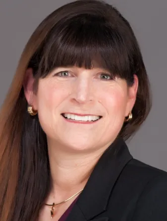 Susan Schaefer Kliman smiling confidently at camera