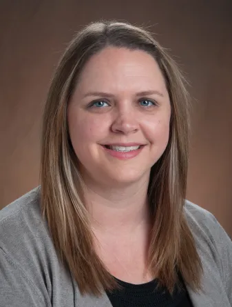 Jenna smiling Confidently at camera