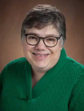 Linda smiling at the camera