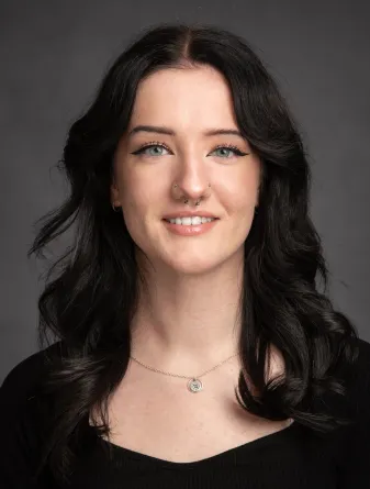 Sophia smiling at the camera