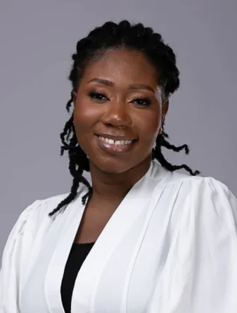 Philomena smiling at the camera