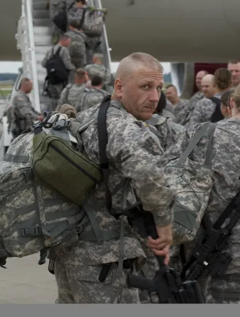 Blake Sykes loading onto deployment aircraft