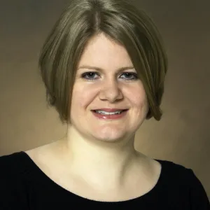 Megan Orr smiling confidently at camera.