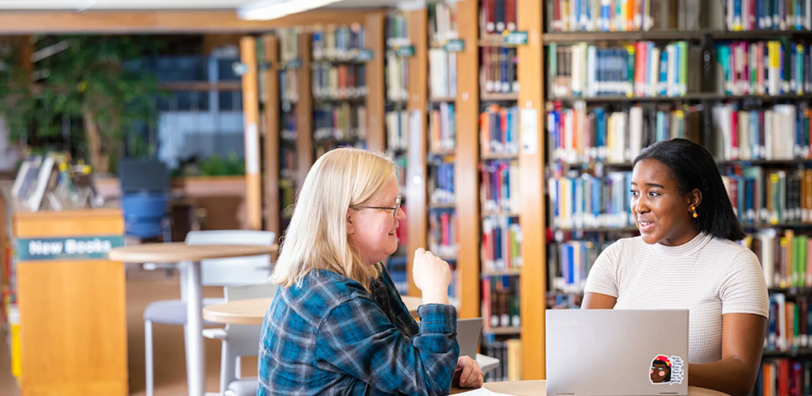 students working on an assignment in a library
