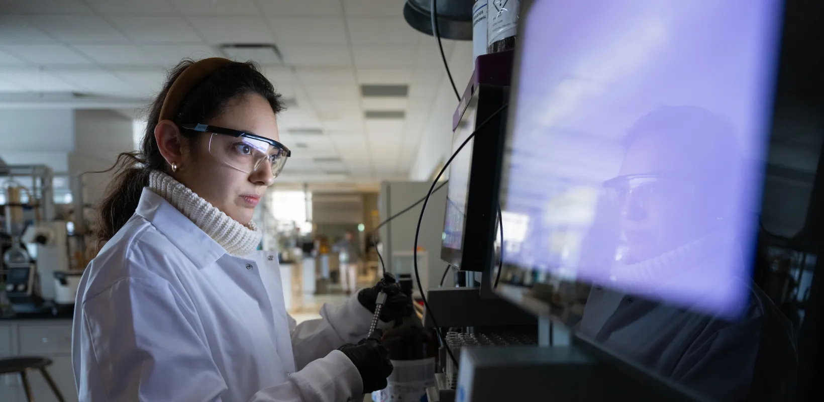 student performing a test in a lab