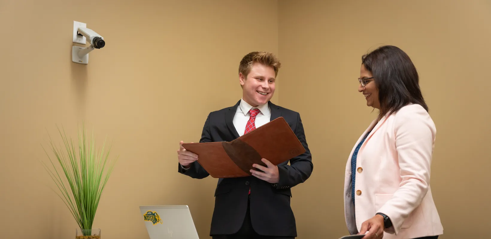 professor helping a student with a presentation