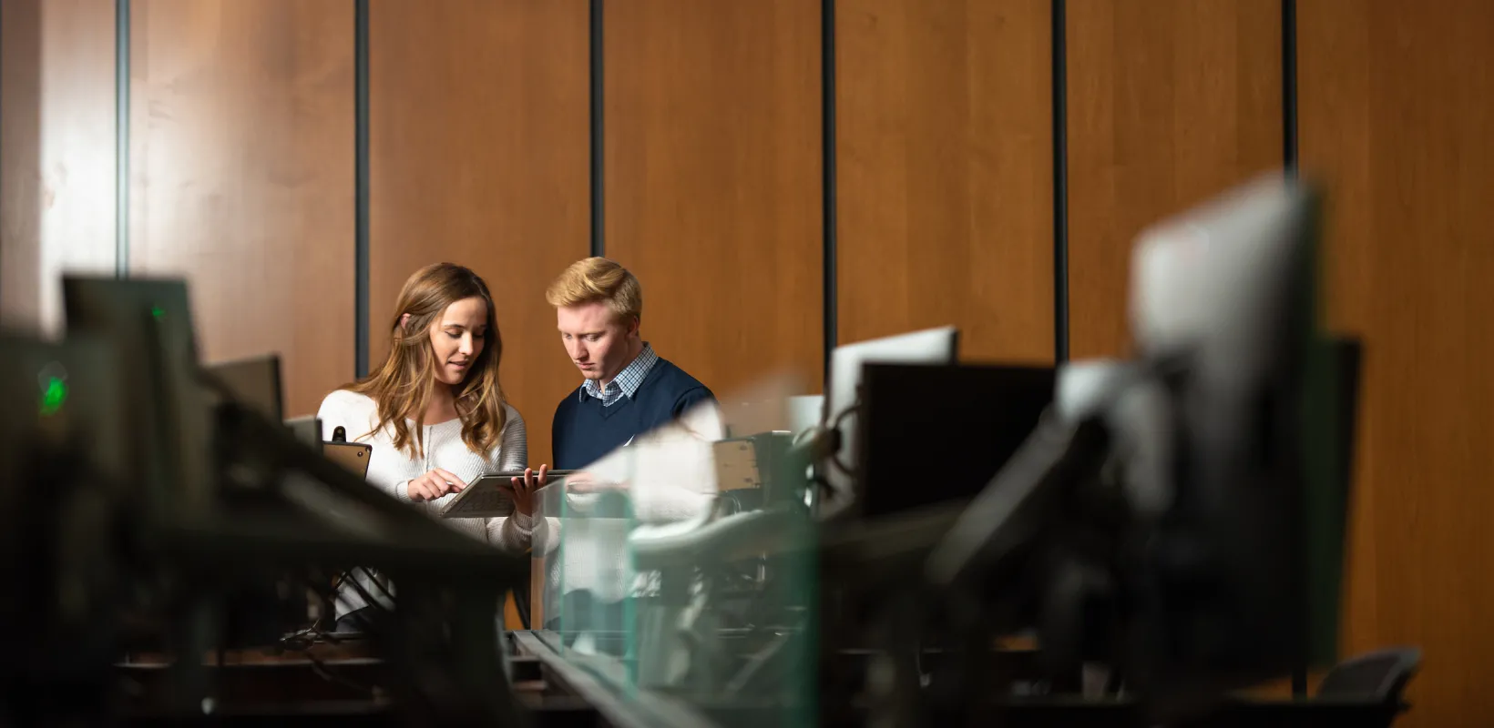 Two students tracking the stock market