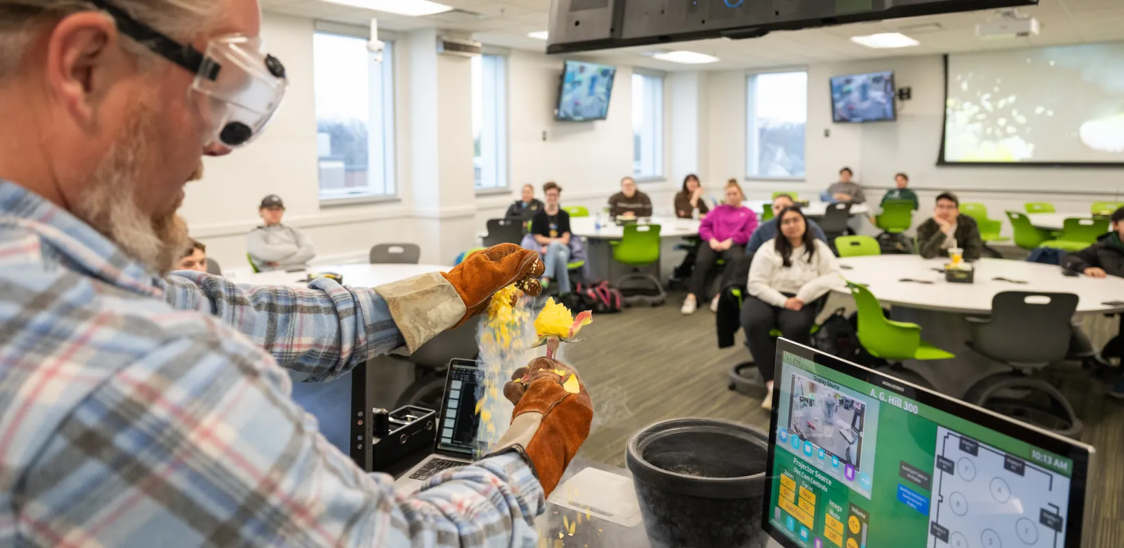 professor performing an experiment in class