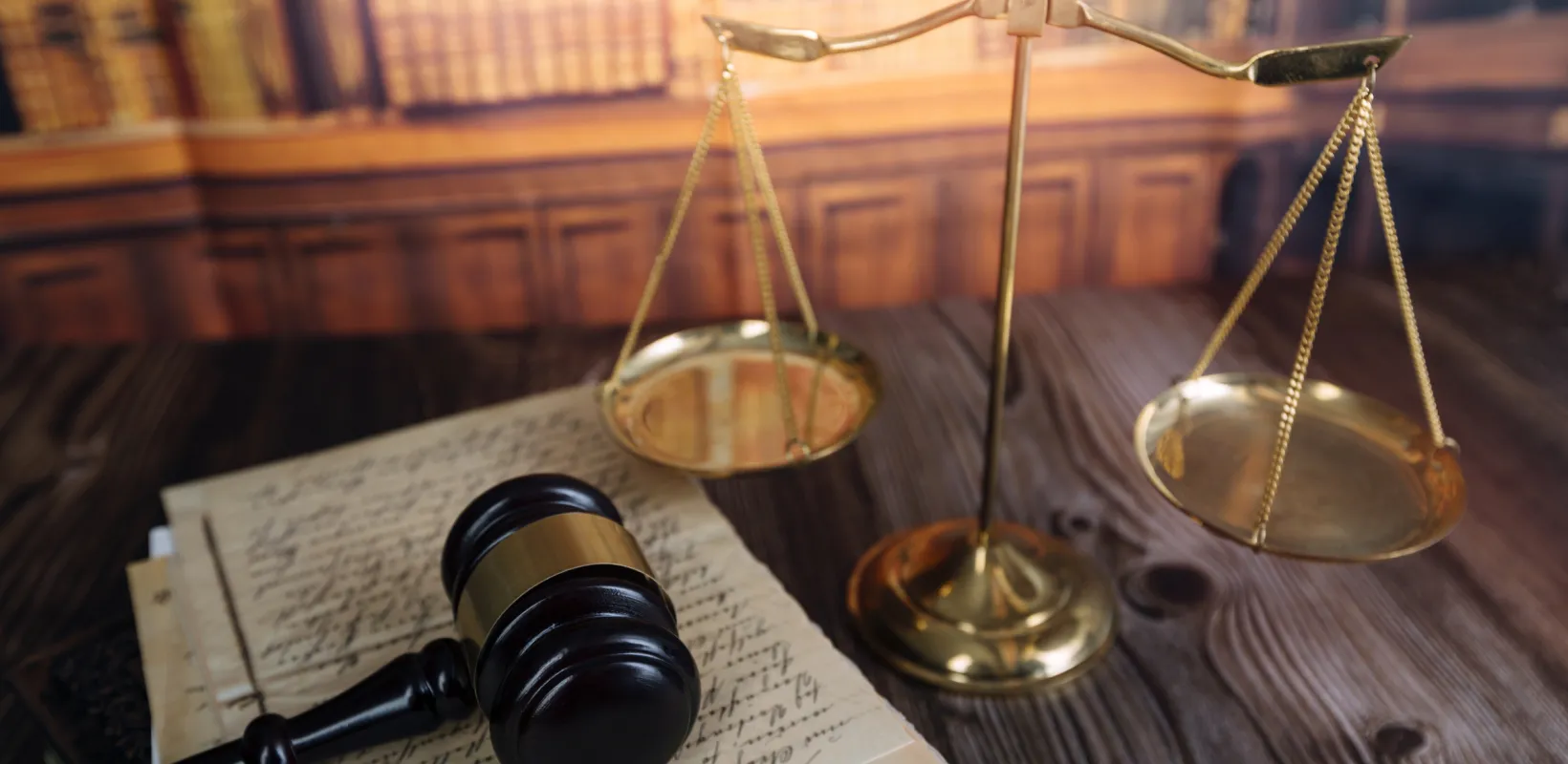 scales of justice and a gavel on a desk