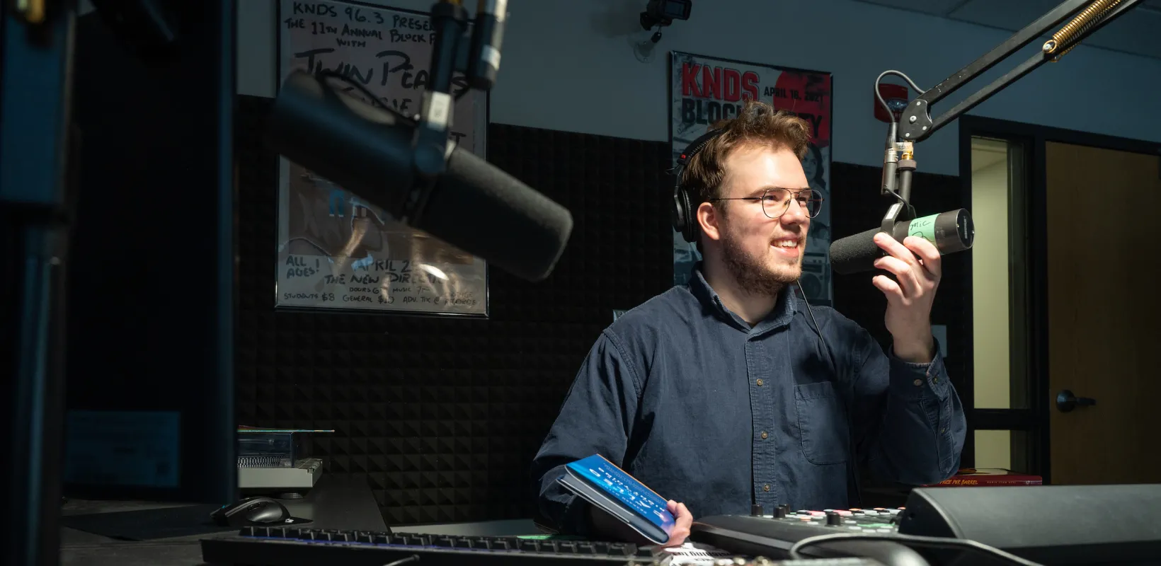 student running a podcast and working in the sound studio