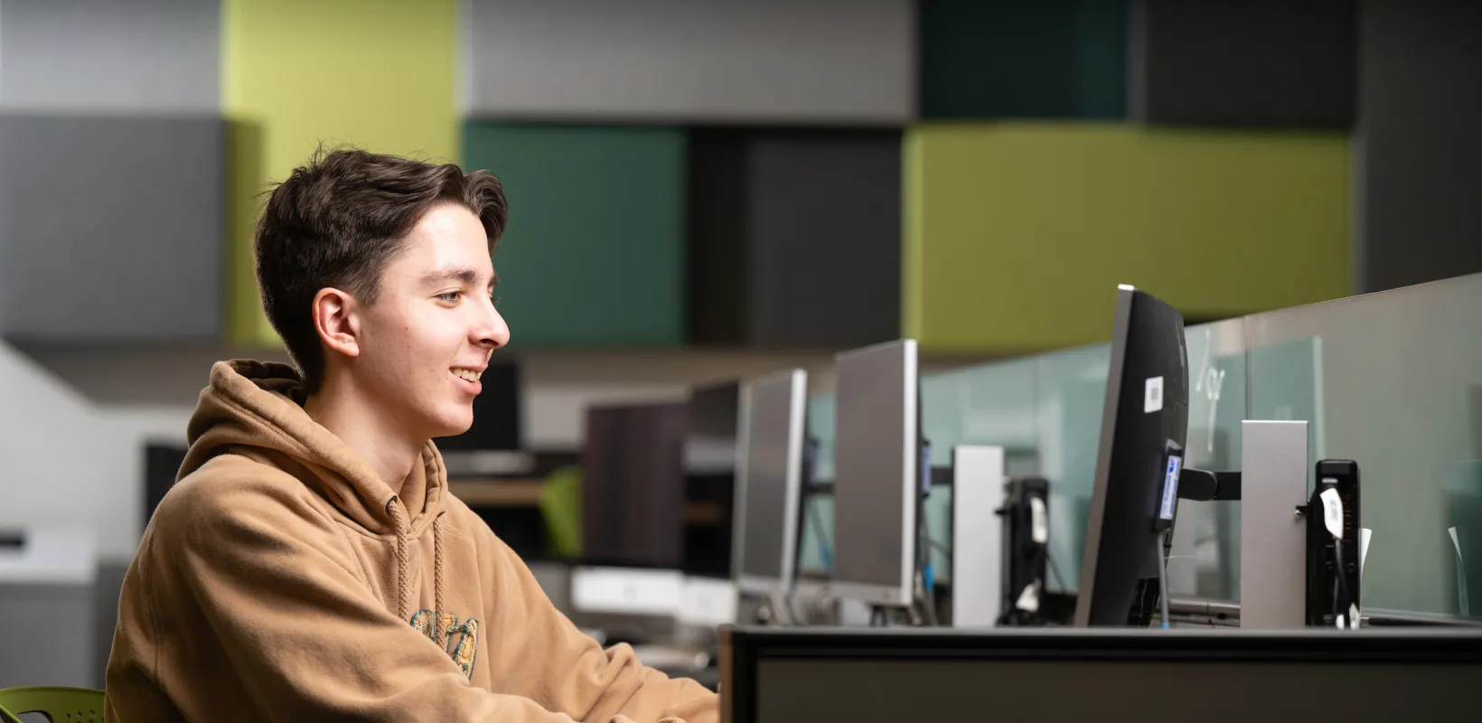 student working on the computer in a lab