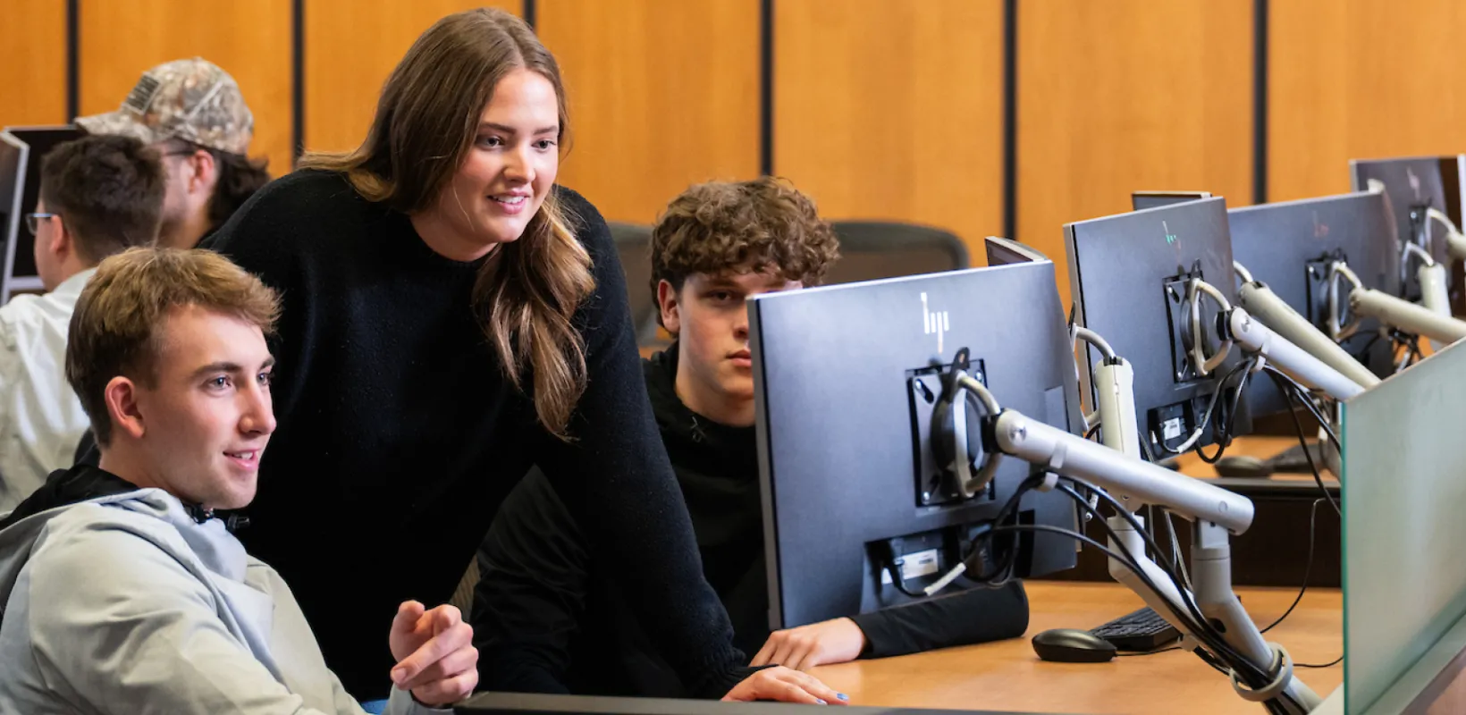 Students looking at computer