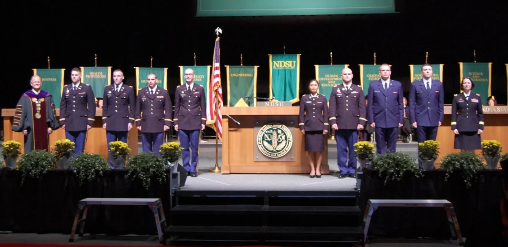 Commissioned Cadets on stage at Commencement Ceremony
