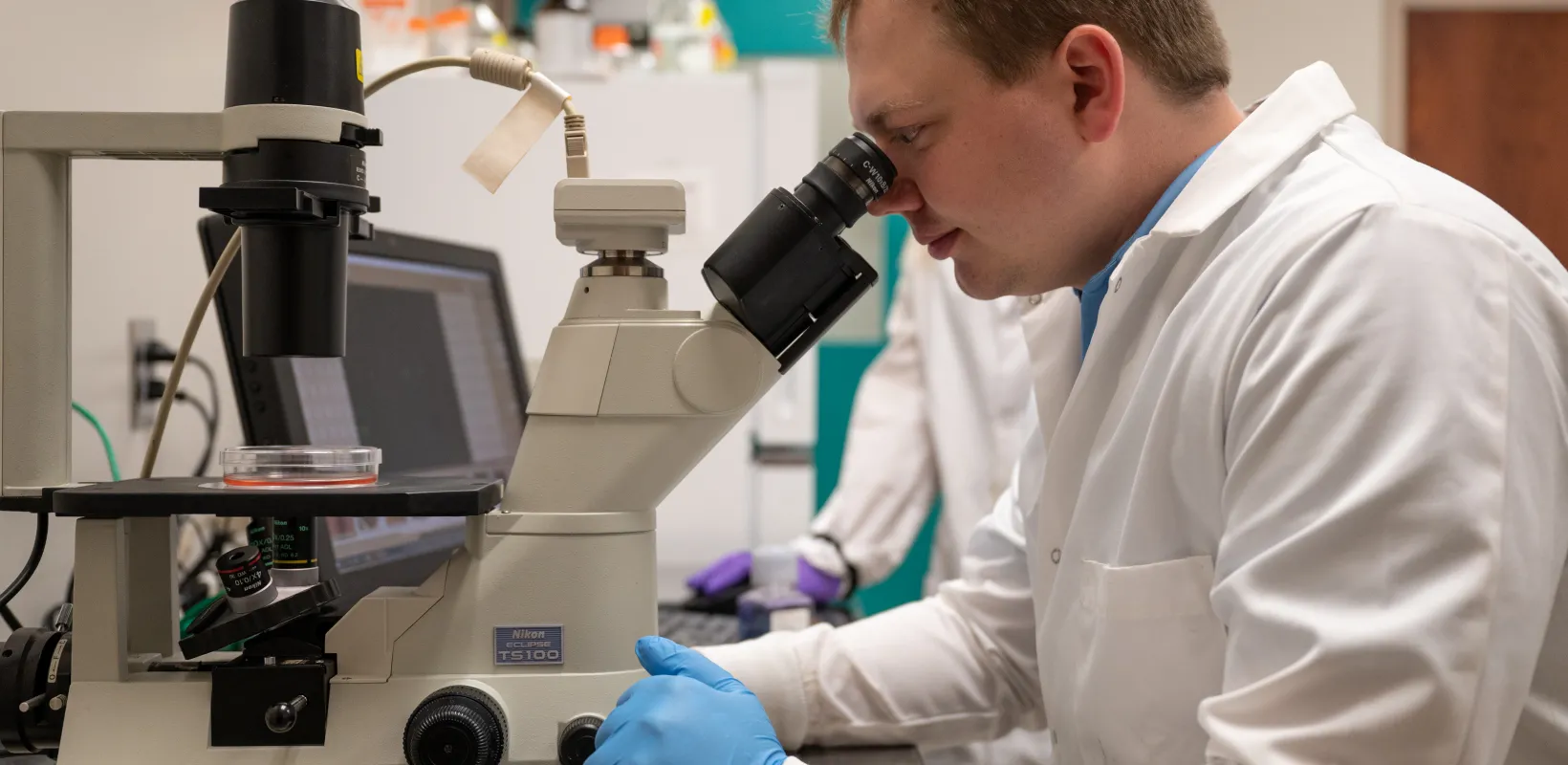 Student performing an experiment in lab