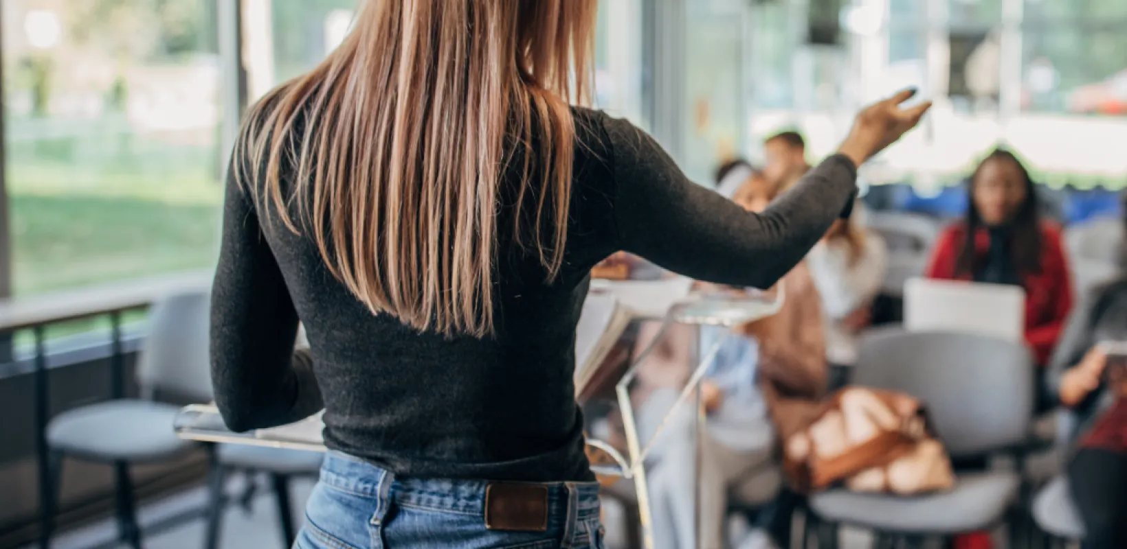 Person Coaching a Group of Employees