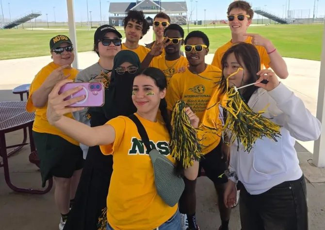 Students and staff taking a selfie